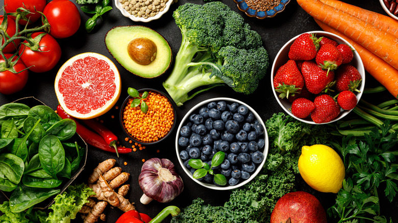 A variety of colorful fruits and vegetables arranged on a table