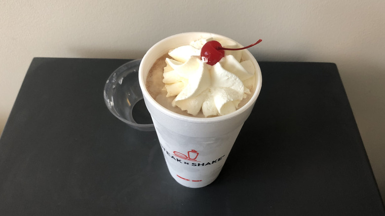 Steak 'n Shake chocolate shake with whipped cream and cherry.
