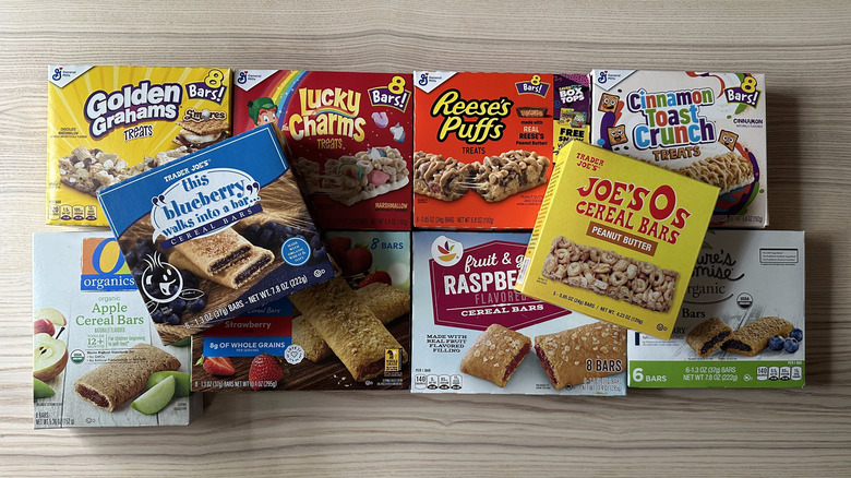 Cereal bar boxes on wooden background