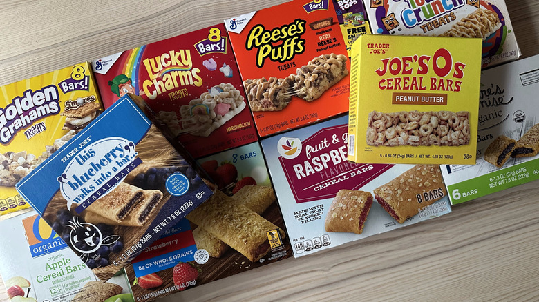 Cereal bar boxes on wooden background