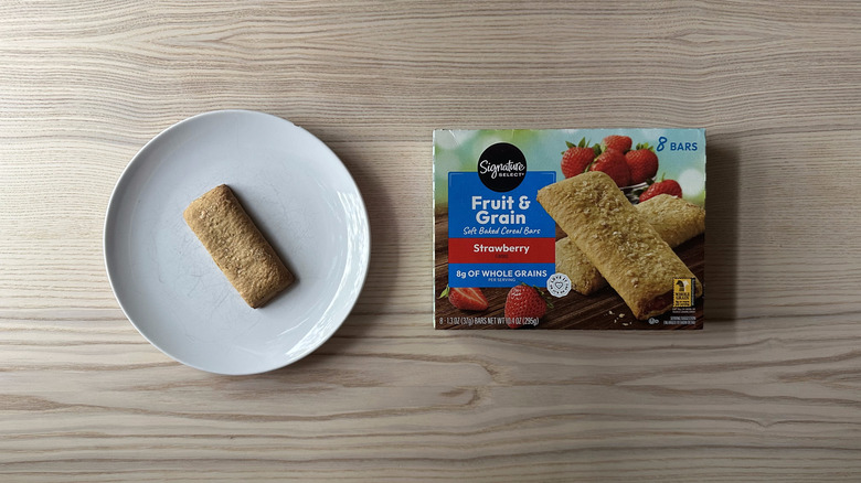 Signature Select Strawberry Soft Baked Cereal Bar on white plate
