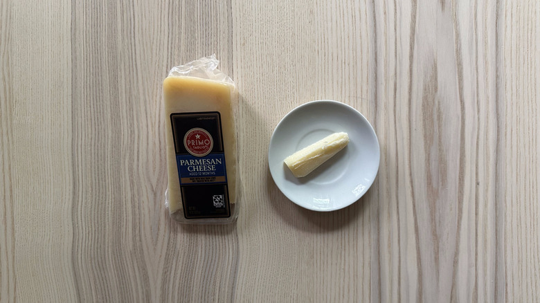Primo Taglio Parmesan Cheese on wooden table