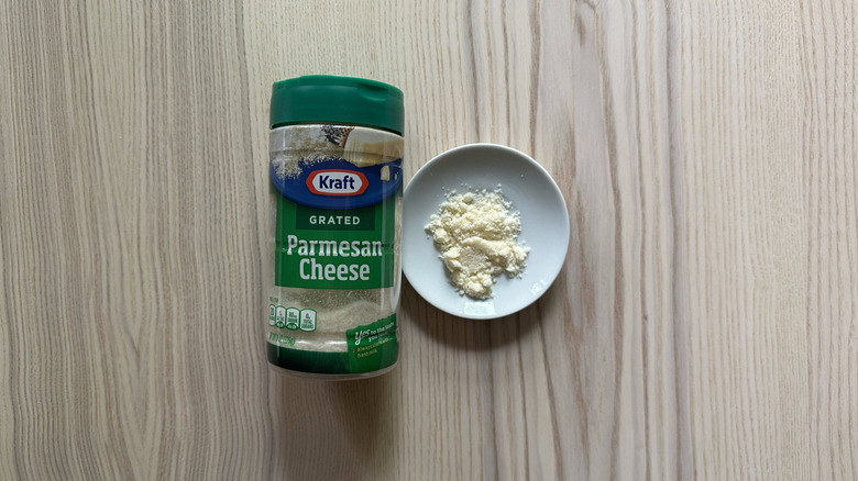 Kraft Grated Parmesan Cheese on wooden table