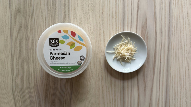 365 Shredded Parmesan Cheese on wooden table