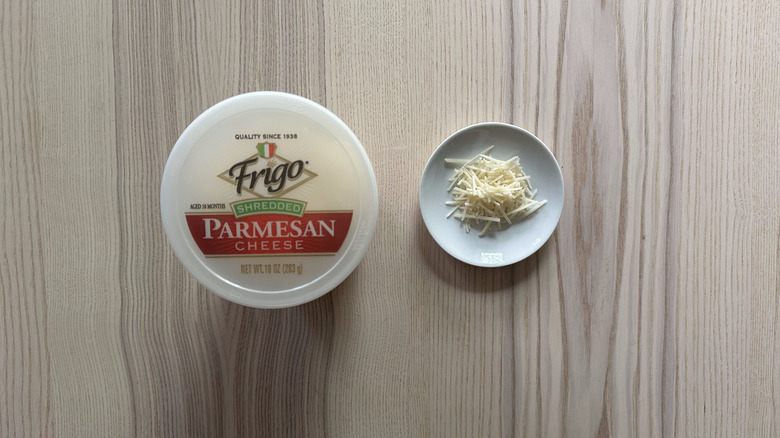 Frigo Shredded Parmesan Cheese on wooden table