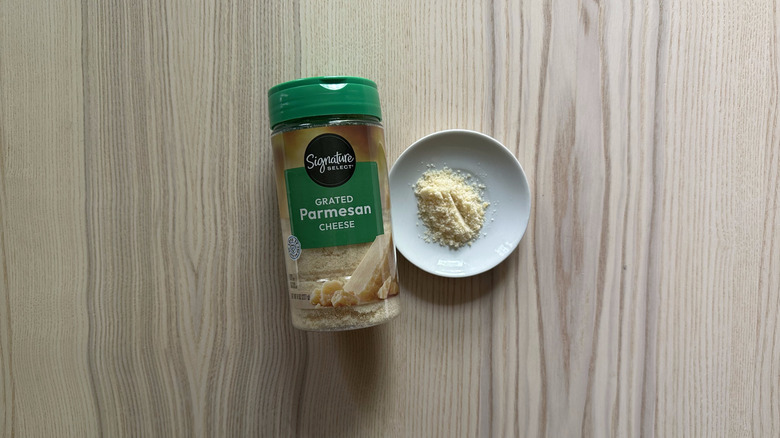 Signature Select Grated Parmesan Cheese on wooden table