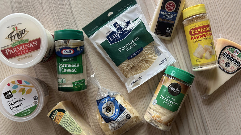 Variety of Parmesan cheese on wooden table