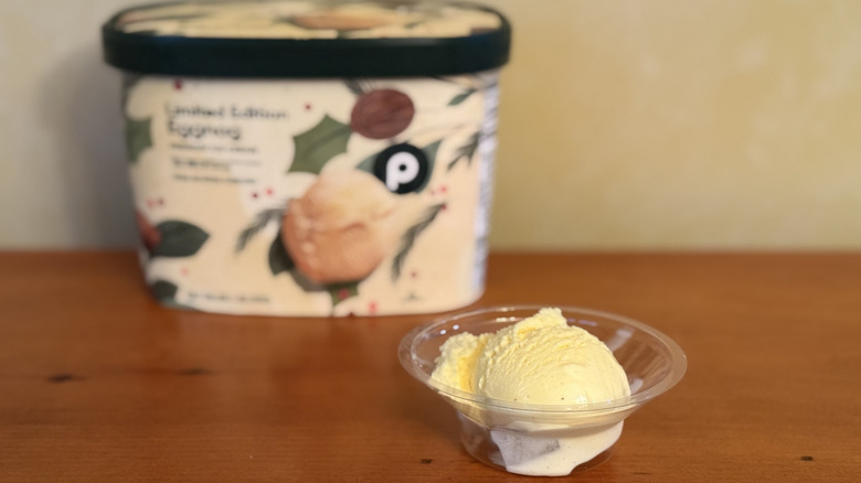 Scoop of ice cream in front of Publix carton