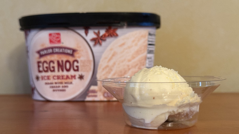 Scoop of ice cream in bowl in front of Harris Teeter carton