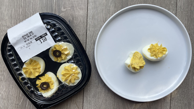 Deviled eggs in container and on plate