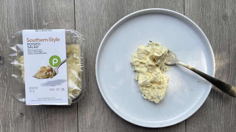 Southern-style potato salad in container and scooped out onto a plate