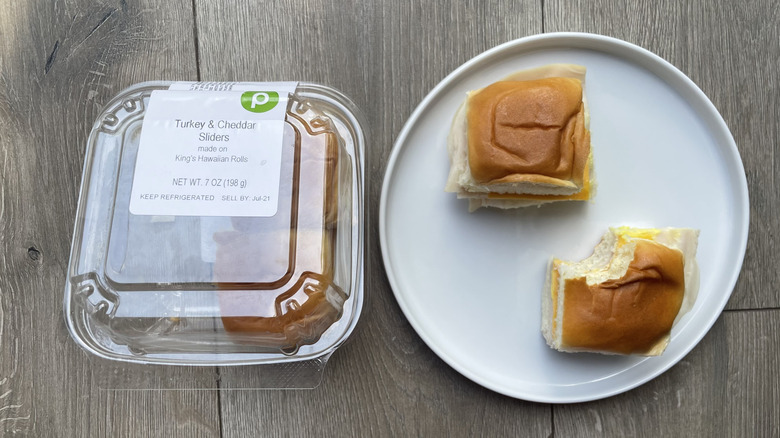 Turkey cheddar sliders in container and on plate