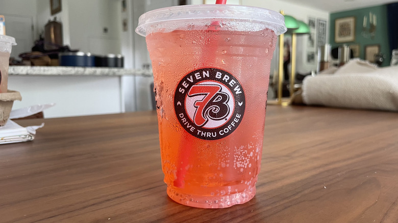 Cherry blossom soda in a cup on a table