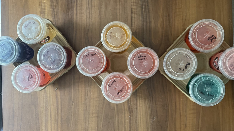 Assortment of 7Brew Fizz sodas on a table in drink carriers
