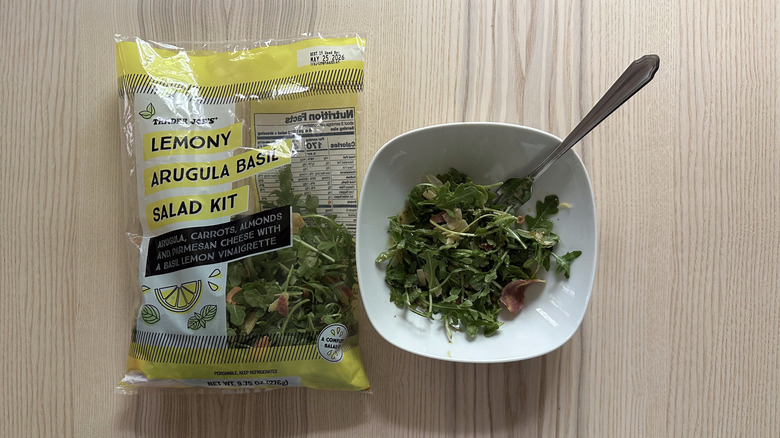 Trader Joe's Lemony Arugula Basil Salad Kit on wooden table