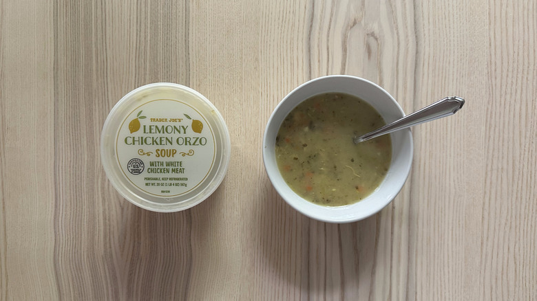 Trader Joe's Lemony Chicken Orzo Soup on wooden table