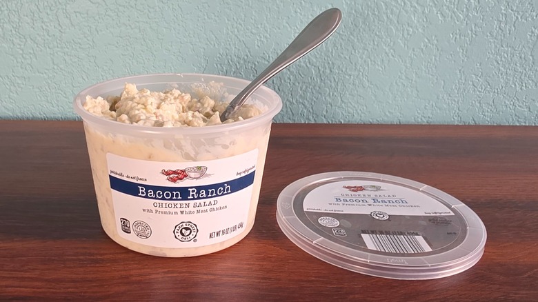 Container of Park Street deli bacon ranch chicken salad open on table with spoon