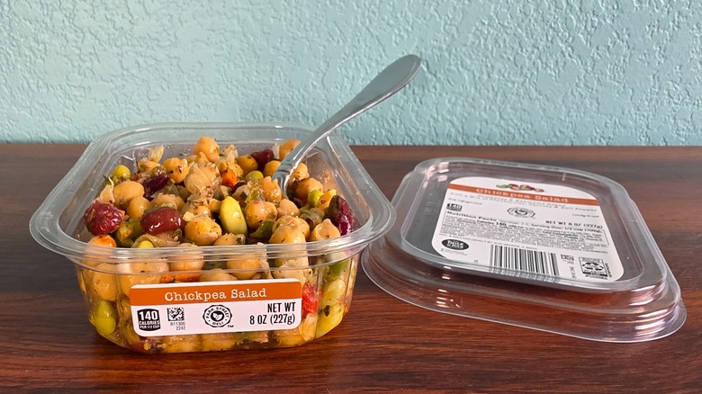 Container of Park Street deli chickpea salad open on table with spoon