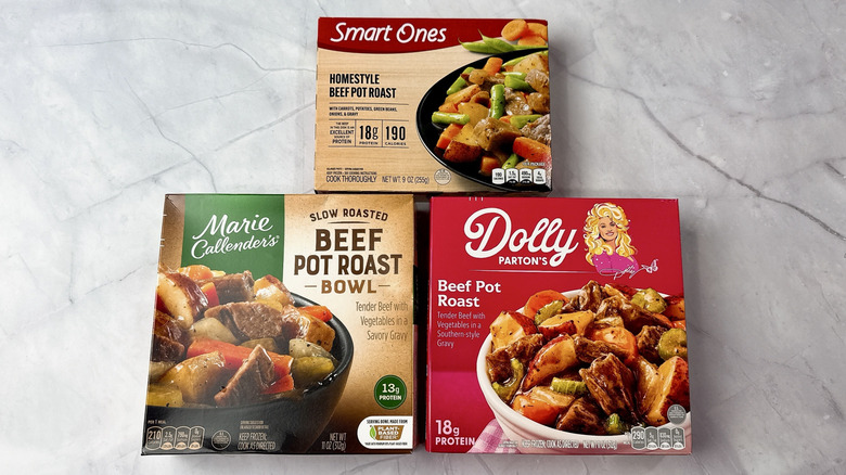 Three boxes of frozen pot roast meals on a countertop