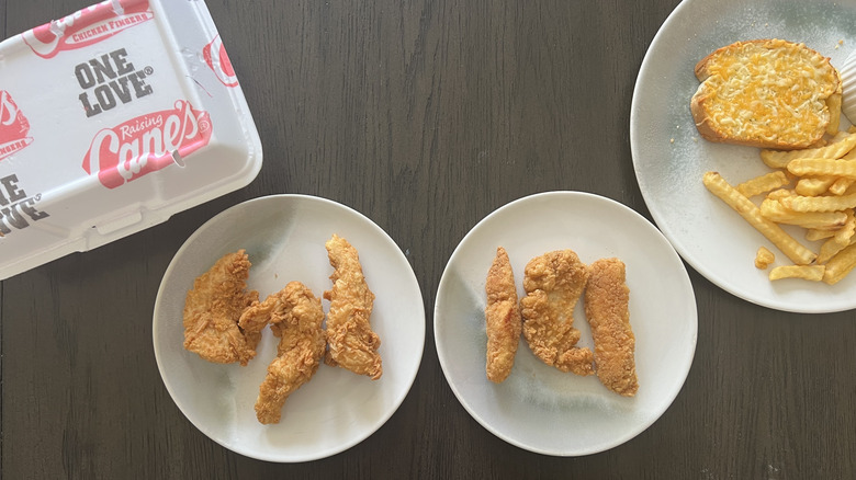 Raising Cane's chicken fingers and Great Value chicken tenders on plates laid on a dark table with packaging on one side