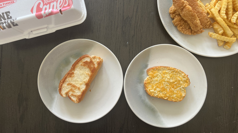 Raising Cane's Texas toast and Great Value Texas toast on two white plates with chicken and fries on the side