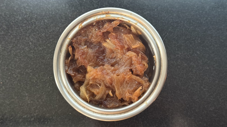 Stainless steel bowl of caramelized onions cooked in Instant Pot