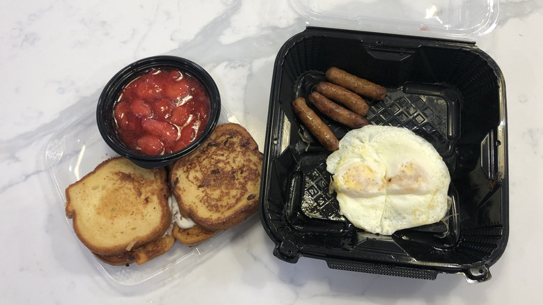 Denny's Berry Stuffed French Toast Slam in a to-go container