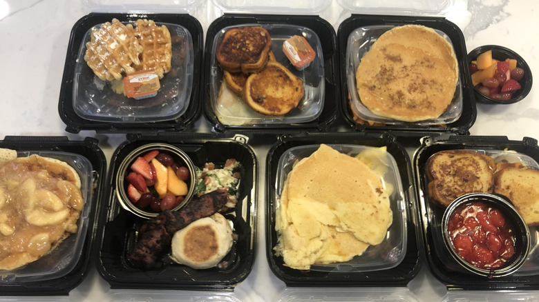 seven different Denny's Slam meals in to-go containers