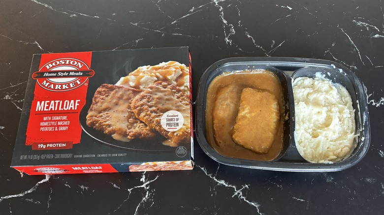 Boston Market frozen meatloaf meal next to box on countertop