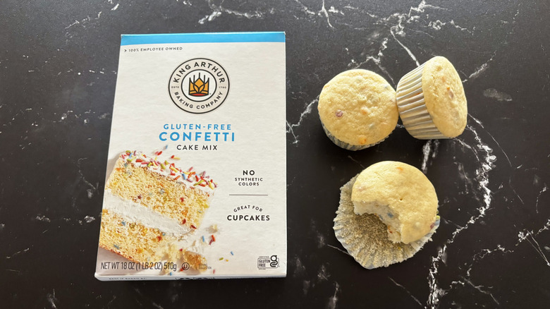 King Arthur confetti cake mix box next to cupcakes
