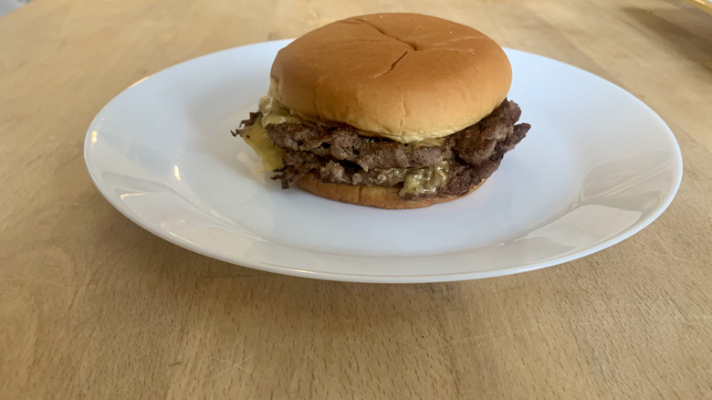 Sonic burger on white plate on wood table