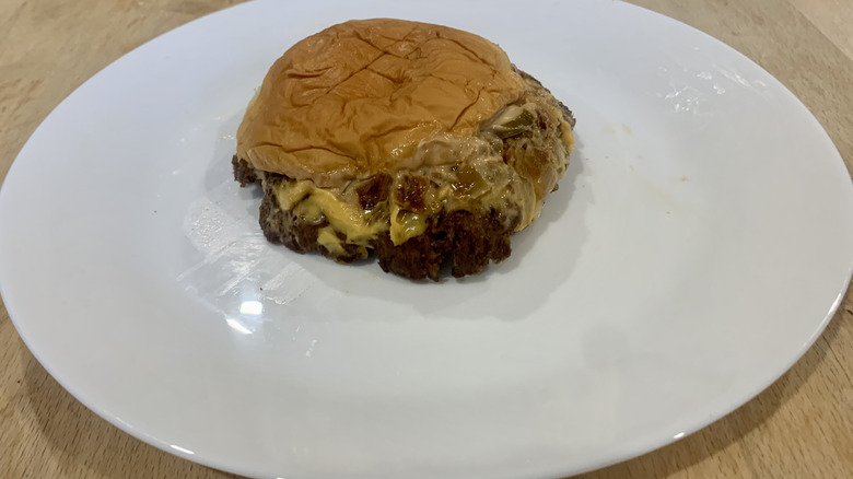 Bareburger burger on white plate on wood table