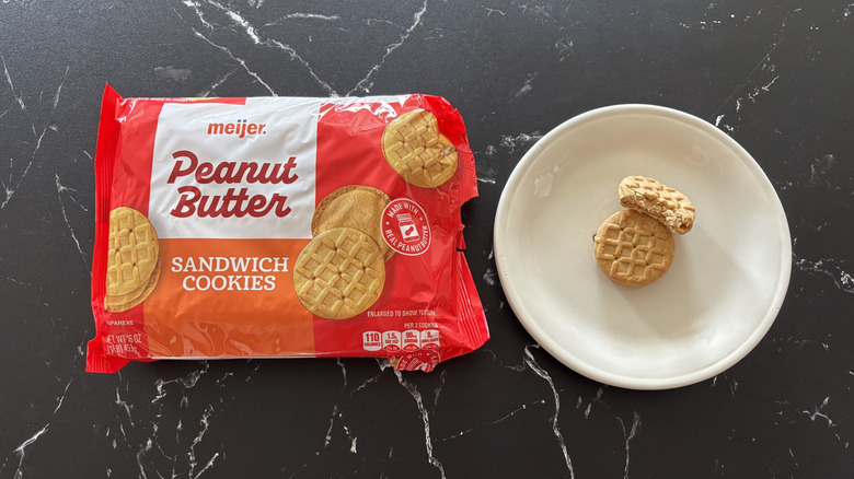 Meijer peanut butter cookie package next to cookies on plate