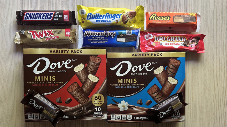 Variety of candy brand ice cream bars on a wooden table