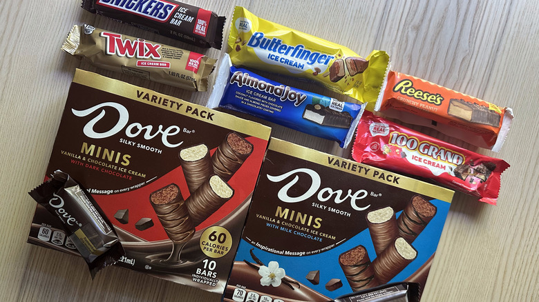 Variety of candy brand ice cream bars on wooden table