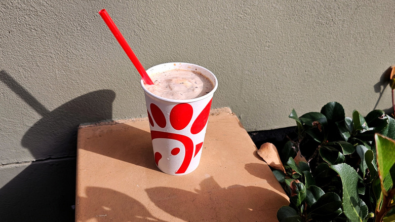 Chick-fil-A Peppermint Chip Frosted Coffee outside against wall