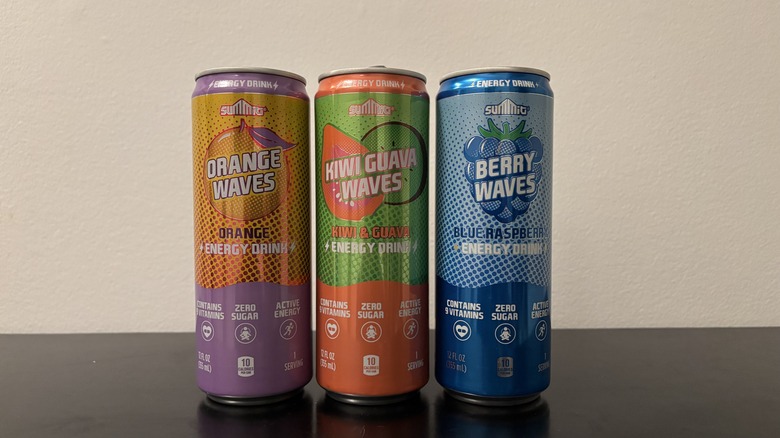 a can of three summit waves energy drink flavors on a table