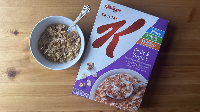 Special K Fruit and Yogurt in white bowl on a wood table next to the cereal box.