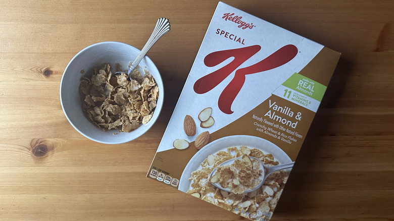 Special K Vanilla and Almond in white bowl on a wood table next to the cereal box.