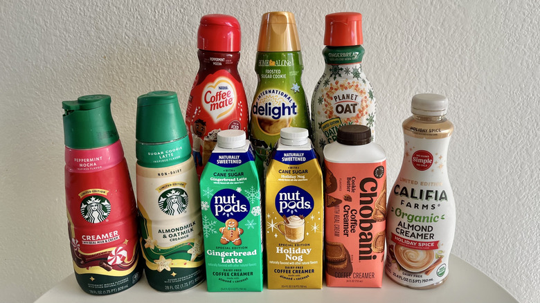 Different holiday creamers on a table