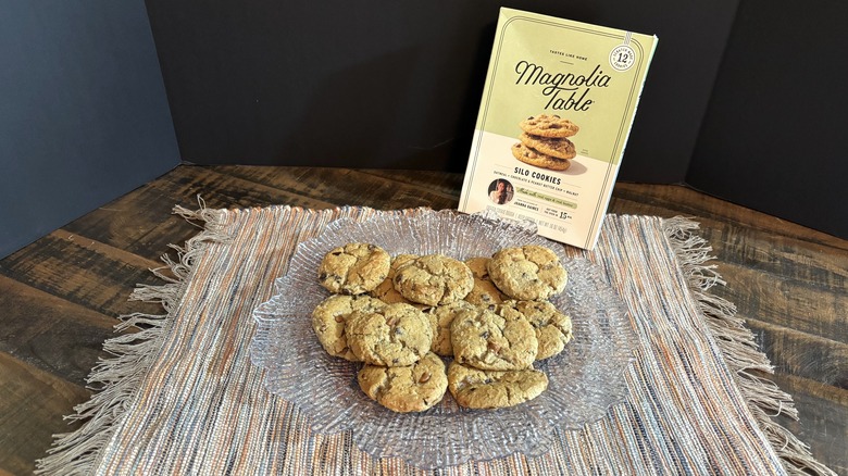 Magnolia Table silo cookies on platter and placemat on wooden table and black background.