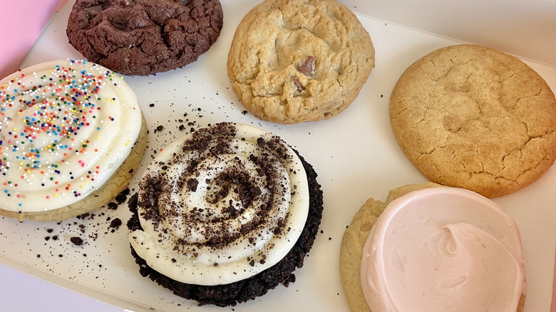 Crumbl cookies in a pink box