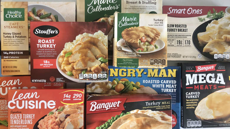 Mix of 10 different frozen turkey dinners in boxes.