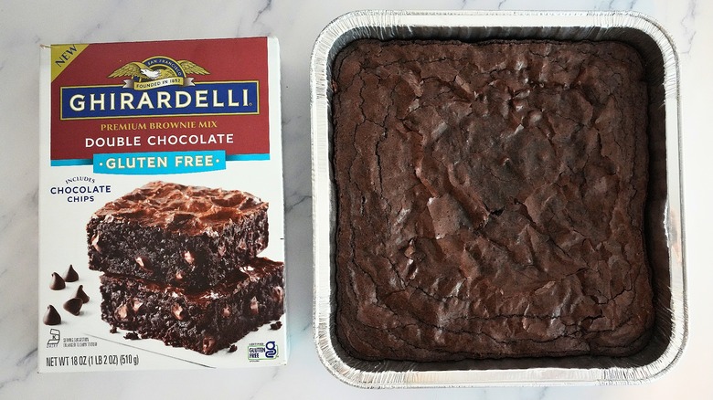 Ghirardelli Gluten Free Double Chocolate Brownies in pan next to box on marble surface