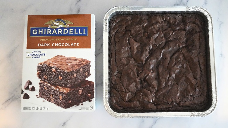 Ghirardelli Dark Chocolate Brownies in pan next to box on marble surface
