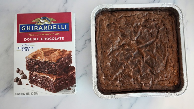 Ghirardelli Double Chocolate Brownies in pan next to box on marble surface