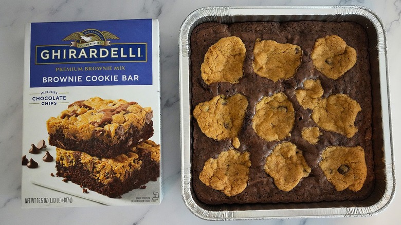 Ghirardelli Brownie Cookie Bars in pan next to box on marble surface