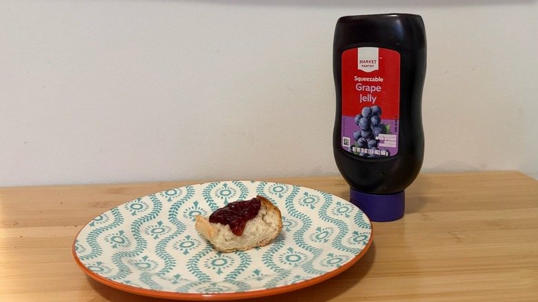 Market Pantry Grape Jelly with a piece of bread and the jelly on top next to it