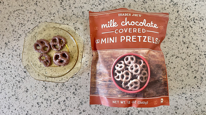 Four Milk Chocolate Covered Mini Pretzels on a plate