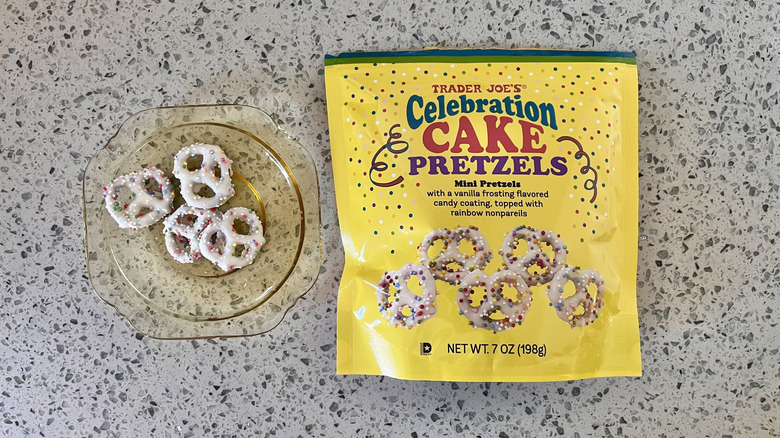 Four pieces of Celebration Cake Pretzels on a plate